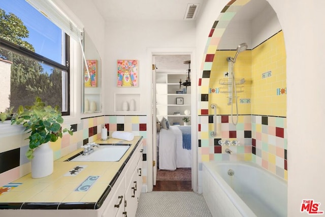 bathroom featuring tile patterned floors and vanity