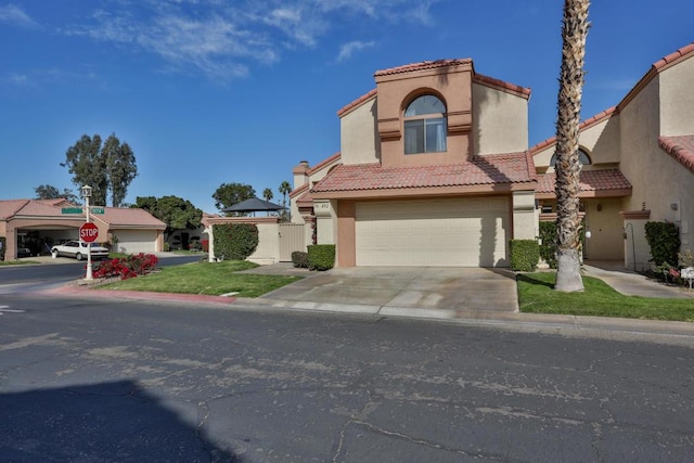 mediterranean / spanish-style home with a garage