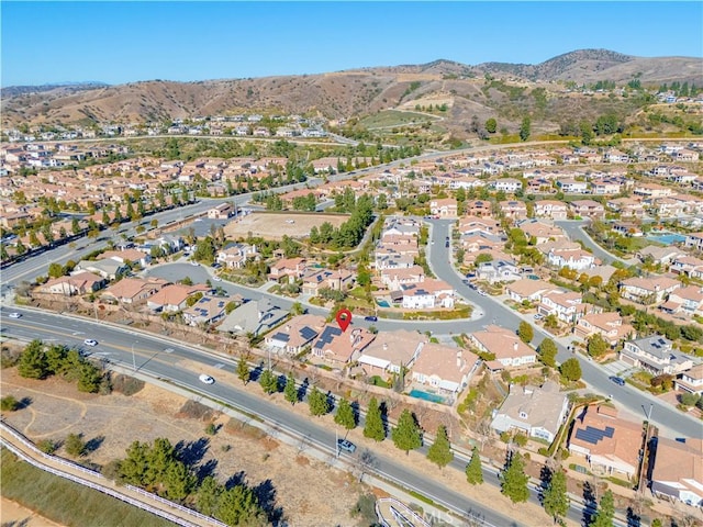 drone / aerial view featuring a mountain view