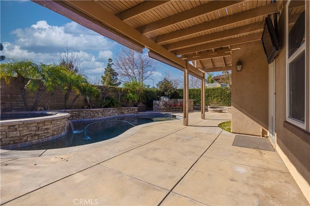 view of patio featuring a pool with hot tub