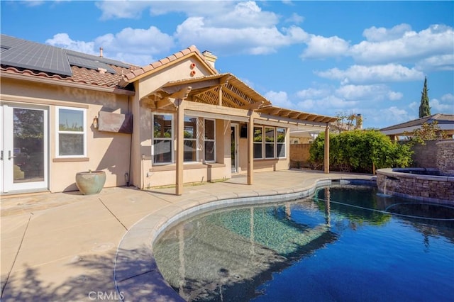 view of swimming pool with an in ground hot tub and a patio