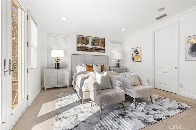 bedroom with ornamental molding and light carpet