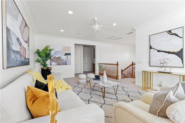 carpeted living room featuring ceiling fan and crown molding