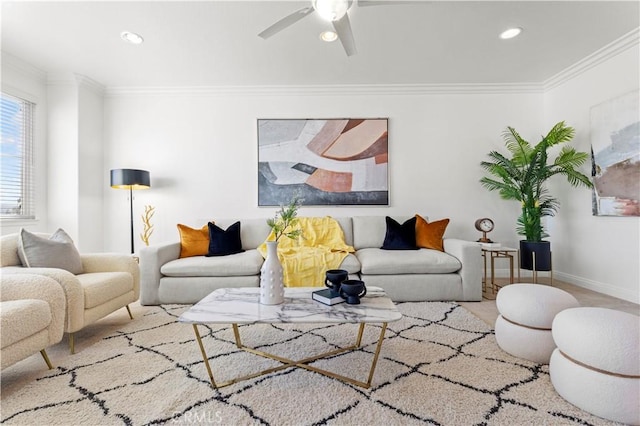 living room with ceiling fan and ornamental molding