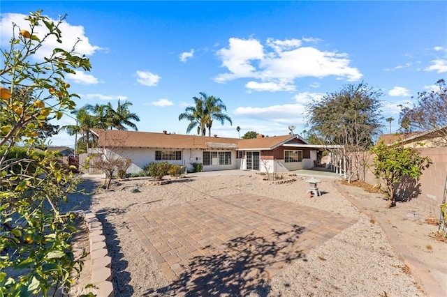 back of property featuring a patio