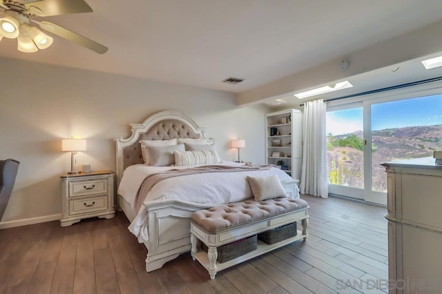 bedroom with ceiling fan and dark wood-type flooring