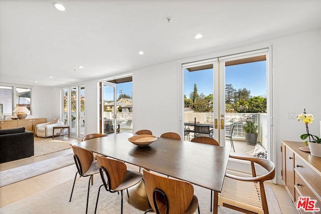 dining space featuring french doors