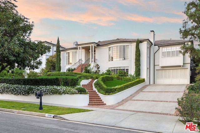 view of front of property featuring a garage