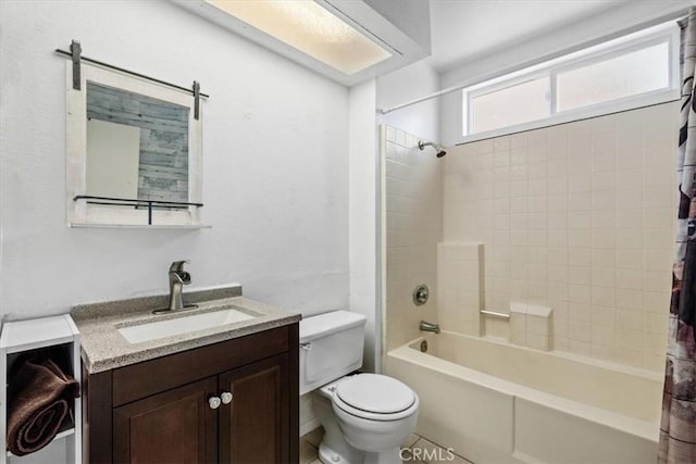 full bathroom with toilet, tile patterned floors, vanity, and shower / bath combo with shower curtain