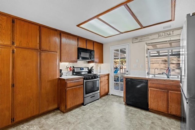 kitchen with sink and black appliances