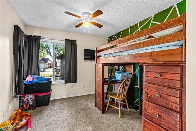 bedroom featuring ceiling fan, a textured ceiling, and carpet floors