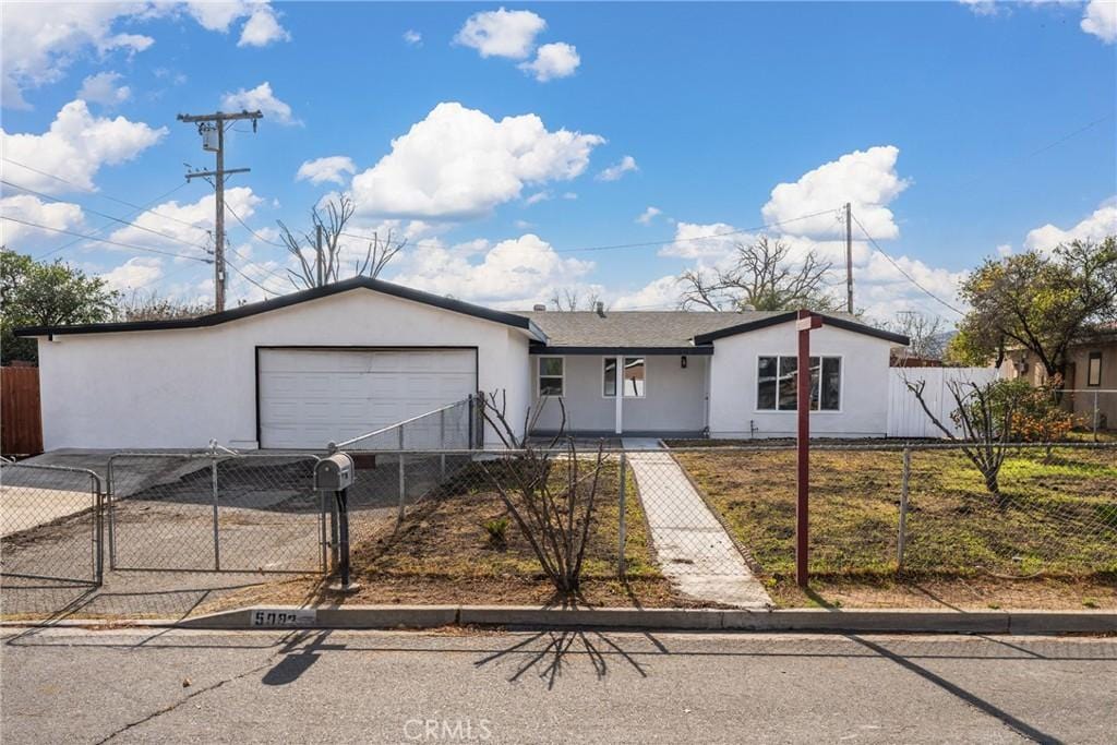 single story home with a garage