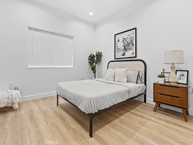 bedroom with light hardwood / wood-style flooring