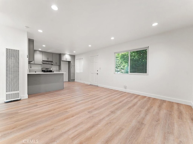 unfurnished living room with light wood-type flooring