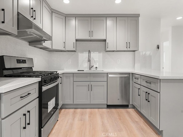 kitchen featuring gray cabinets, appliances with stainless steel finishes, and sink