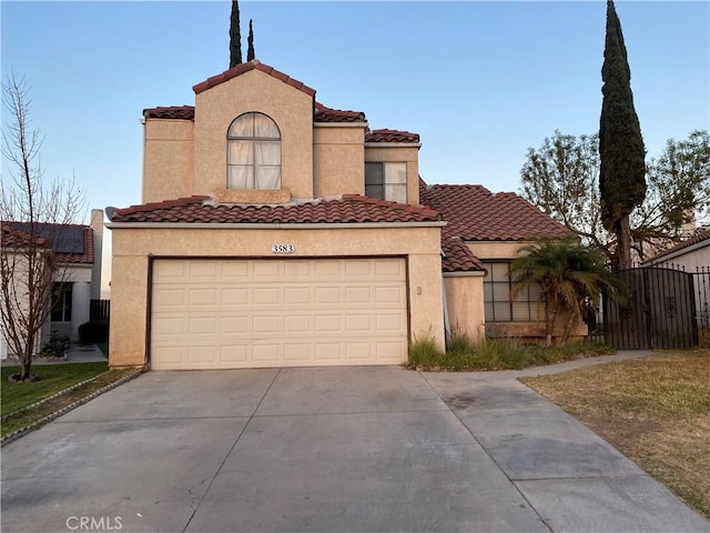 mediterranean / spanish-style house featuring a garage