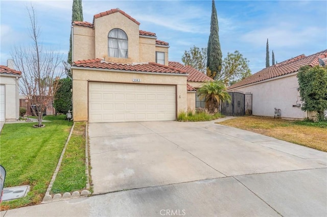 mediterranean / spanish house featuring a garage and a front yard