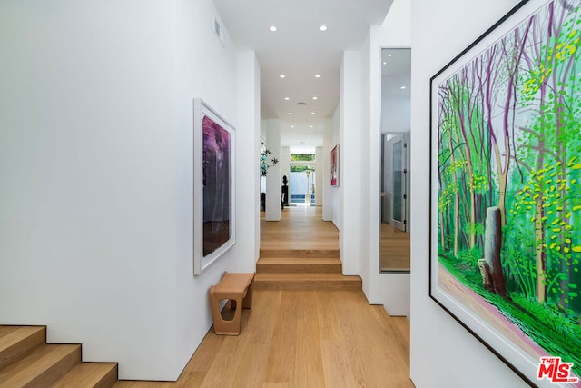 hallway with light wood-type flooring