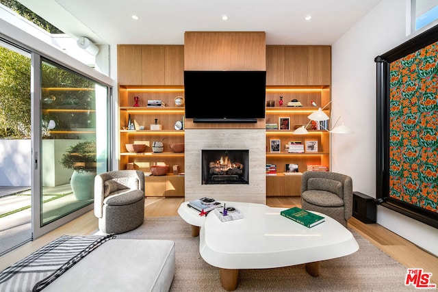 living room with light wood-type flooring and a healthy amount of sunlight