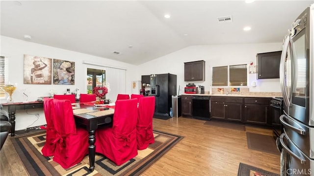 dining space with lofted ceiling, light wood-style flooring, visible vents, and recessed lighting