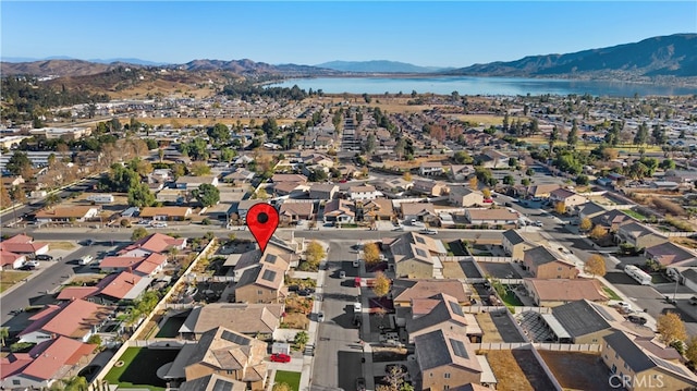 bird's eye view featuring a residential view and a water and mountain view