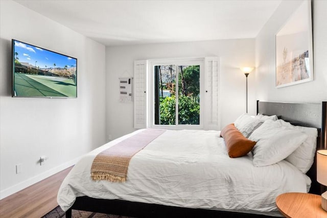 bedroom with hardwood / wood-style floors