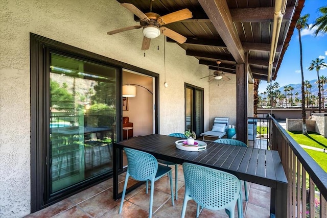 balcony featuring ceiling fan