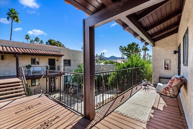 wooden deck featuring a mountain view