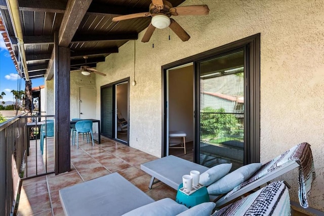 view of patio / terrace featuring ceiling fan and a balcony