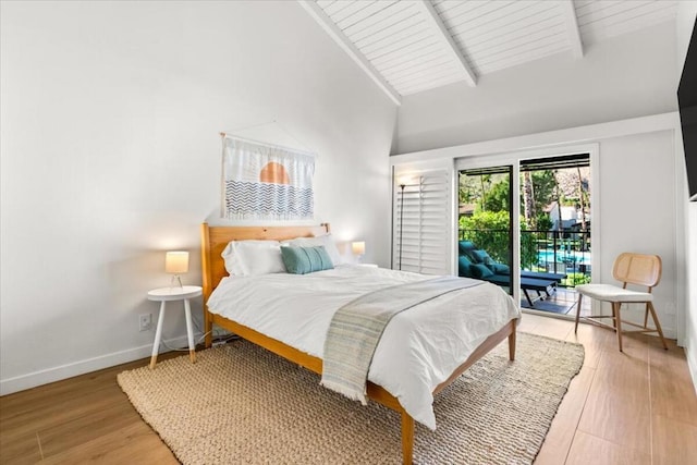 bedroom featuring access to exterior, wood ceiling, beam ceiling, and hardwood / wood-style flooring