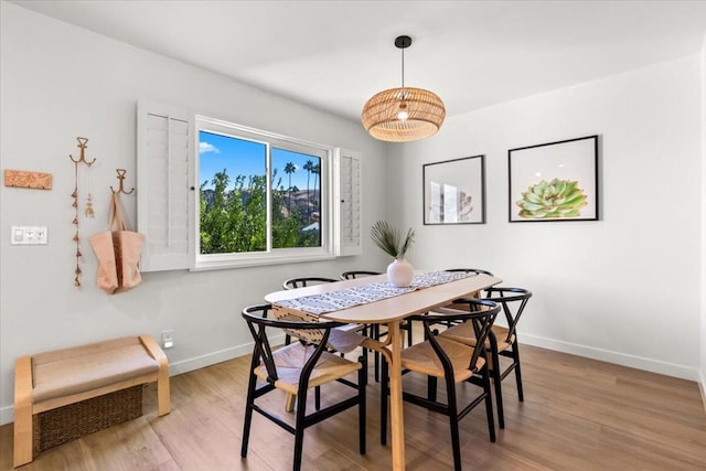 dining area with light hardwood / wood-style flooring