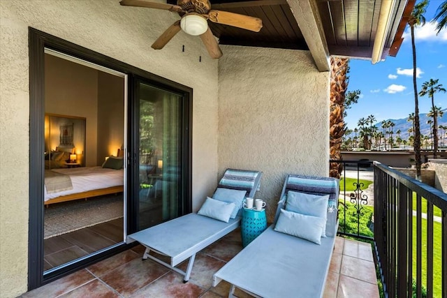 balcony with ceiling fan and a mountain view