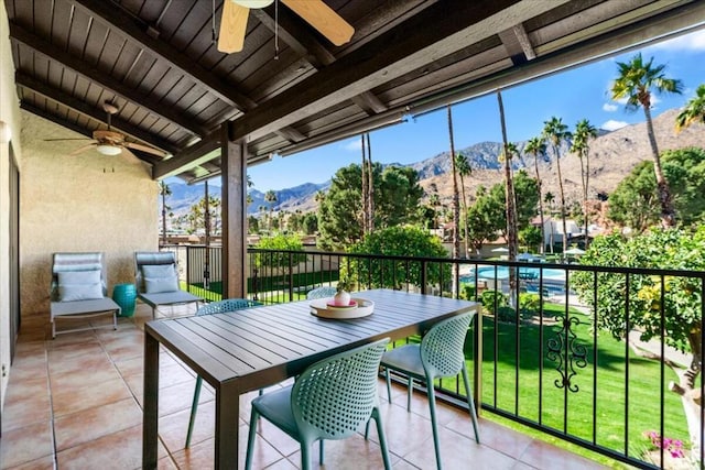 balcony with ceiling fan and a mountain view