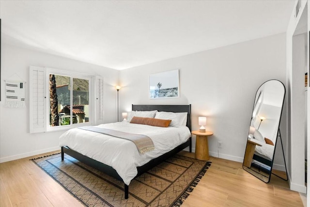 bedroom with light wood-type flooring