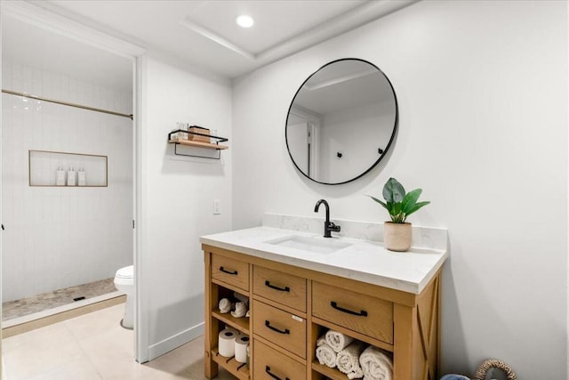 bathroom with toilet, a tile shower, tile patterned floors, and vanity