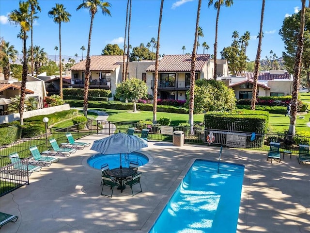 view of swimming pool featuring a patio