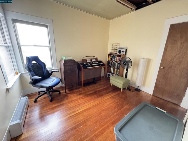 office featuring hardwood / wood-style flooring and a baseboard radiator