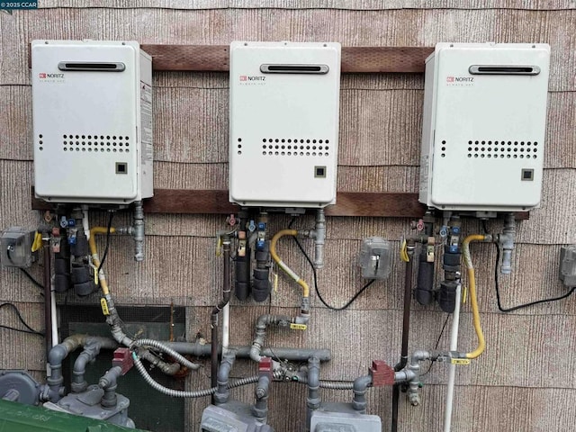 utility room featuring water heater