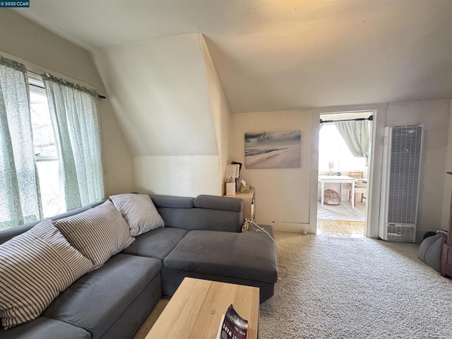 living room with carpet and lofted ceiling