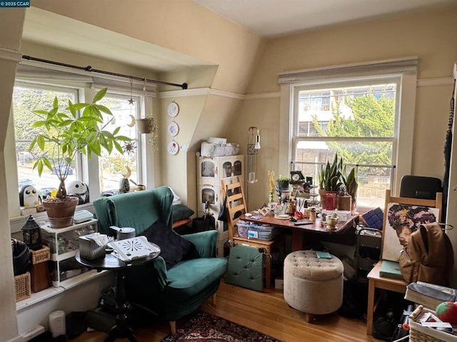 home office with hardwood / wood-style flooring and lofted ceiling