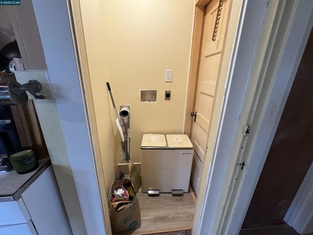 laundry area with washer / dryer and hardwood / wood-style floors