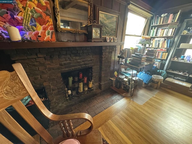 sitting room featuring a fireplace and hardwood / wood-style flooring