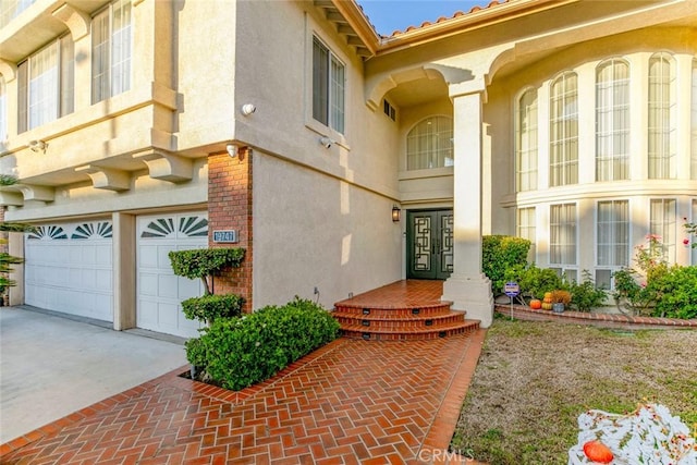 doorway to property featuring a garage