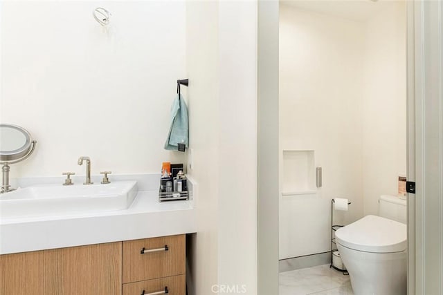 bathroom with toilet and vanity