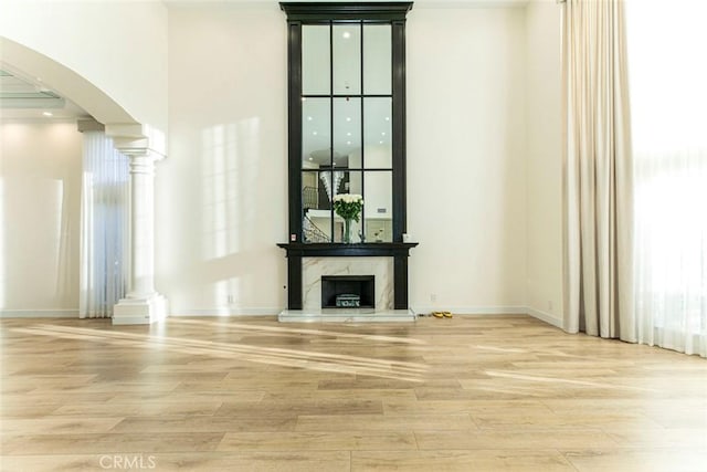 unfurnished living room featuring a fireplace