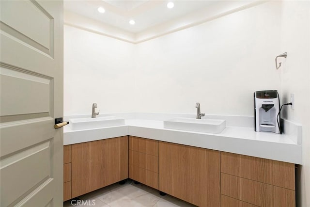 bathroom featuring tile patterned floors and vanity