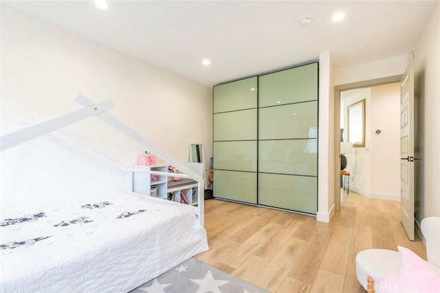 bedroom featuring light hardwood / wood-style floors