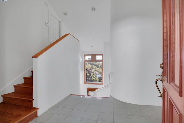 entryway with light tile patterned floors