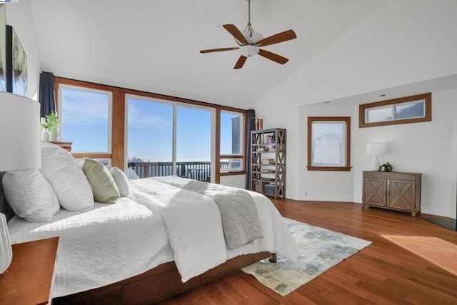 bedroom with ceiling fan, hardwood / wood-style flooring, high vaulted ceiling, and access to outside