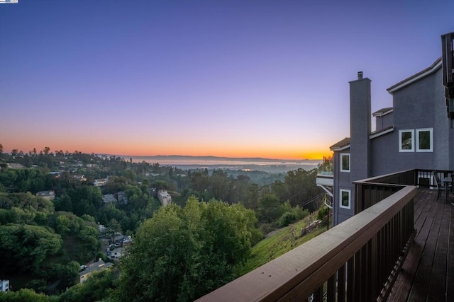 view of balcony at dusk